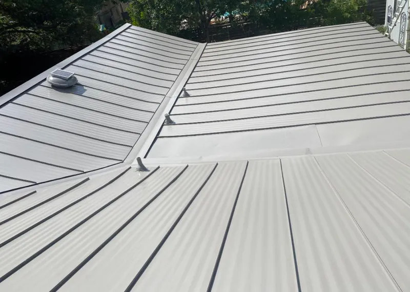 Solar attic fan installed on a metal roof for Roof Ventilation in Swainsboro